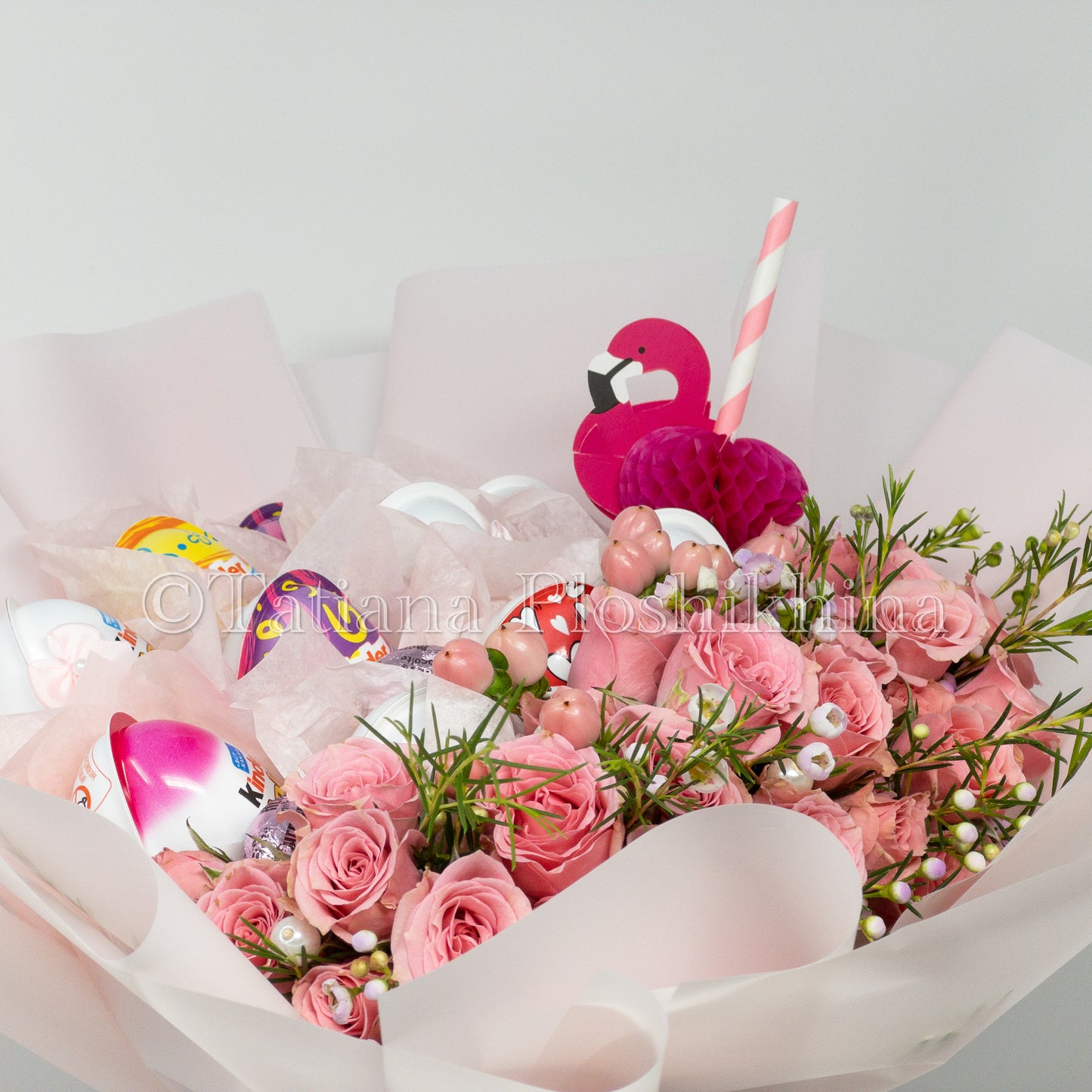 kinder chocolate and fresh spray roses bouquet.