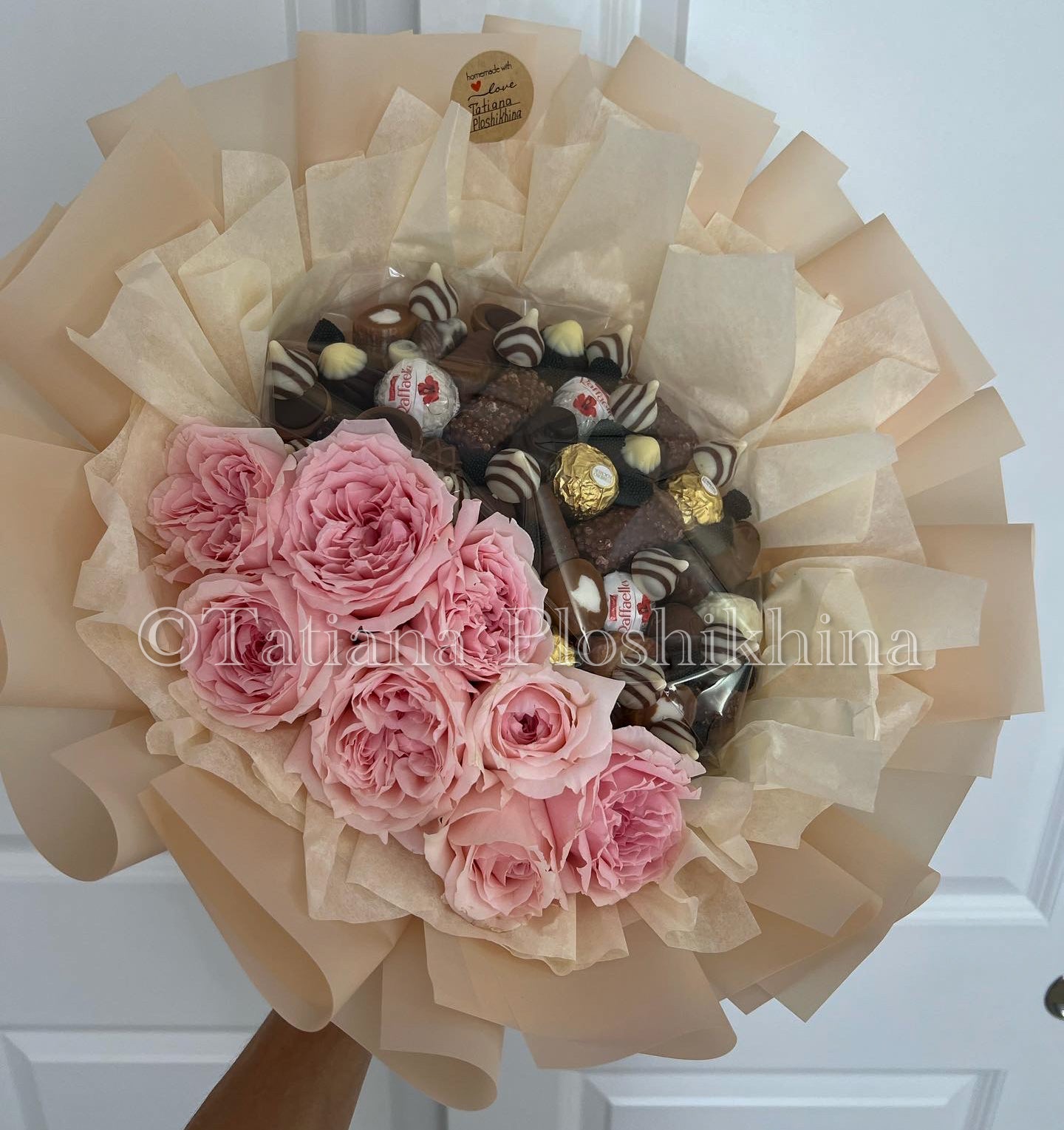 Candies and fresh flowers bouquet