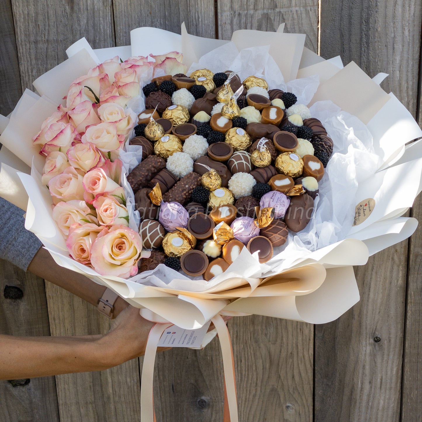 Candies and fresh flowers bouquet