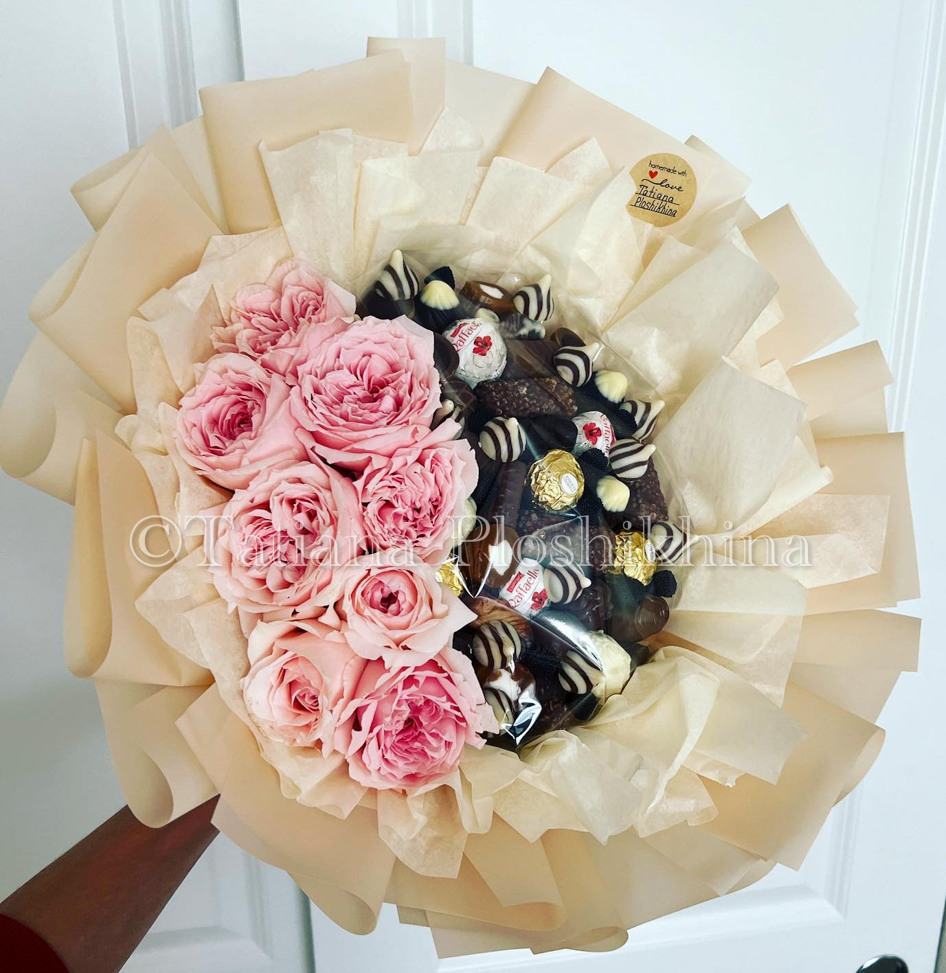 Candies and fresh flowers bouquet