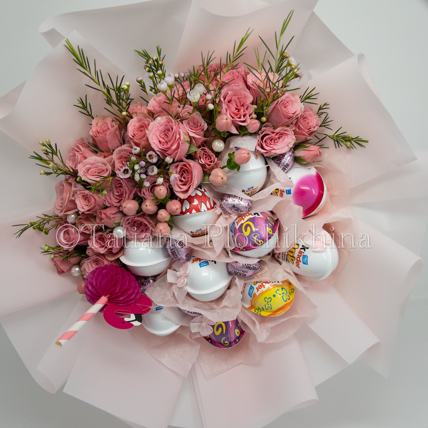 kinder chocolate and fresh spray roses bouquet.