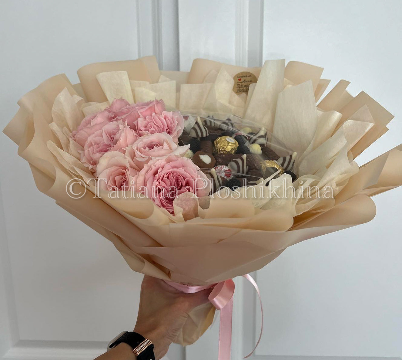 Candies and fresh flowers bouquet