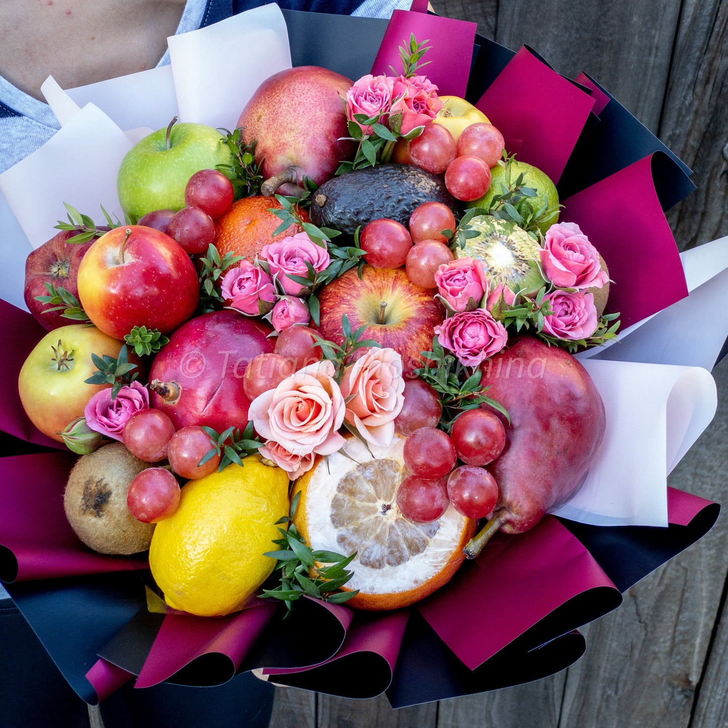 Seasonal fruits and fresh spray rose