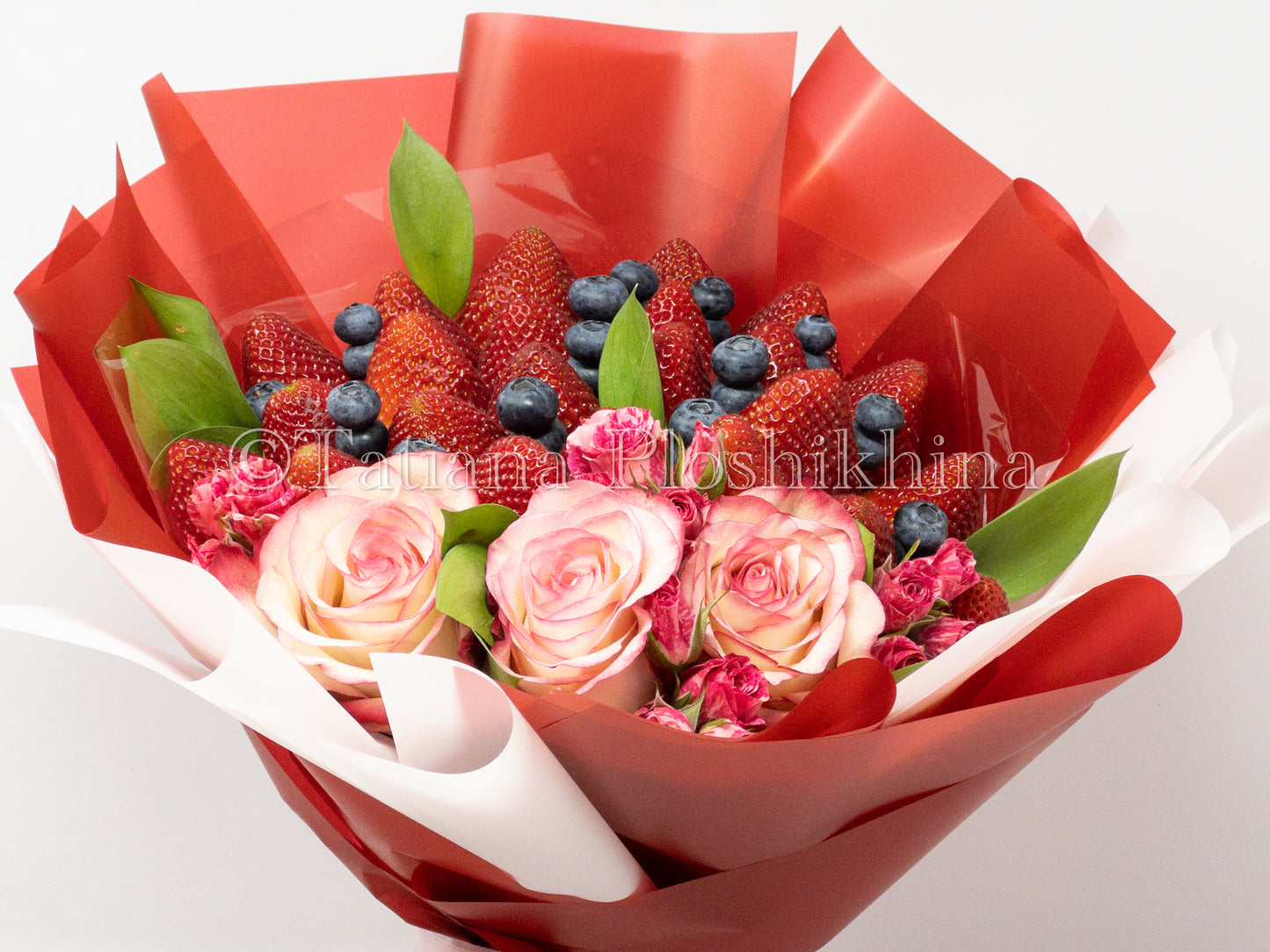 Berrys and fresh roses bouquet