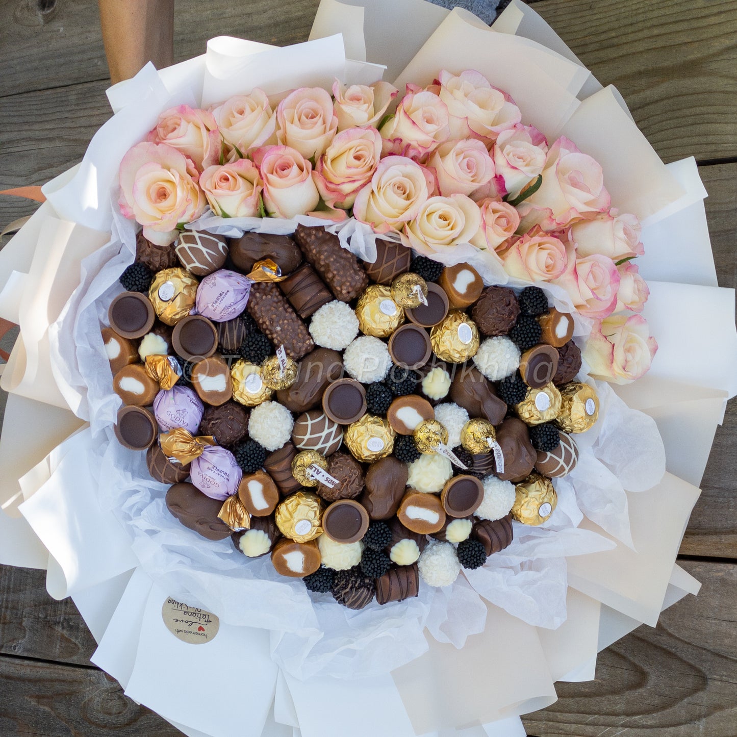 Candies and fresh flowers bouquet