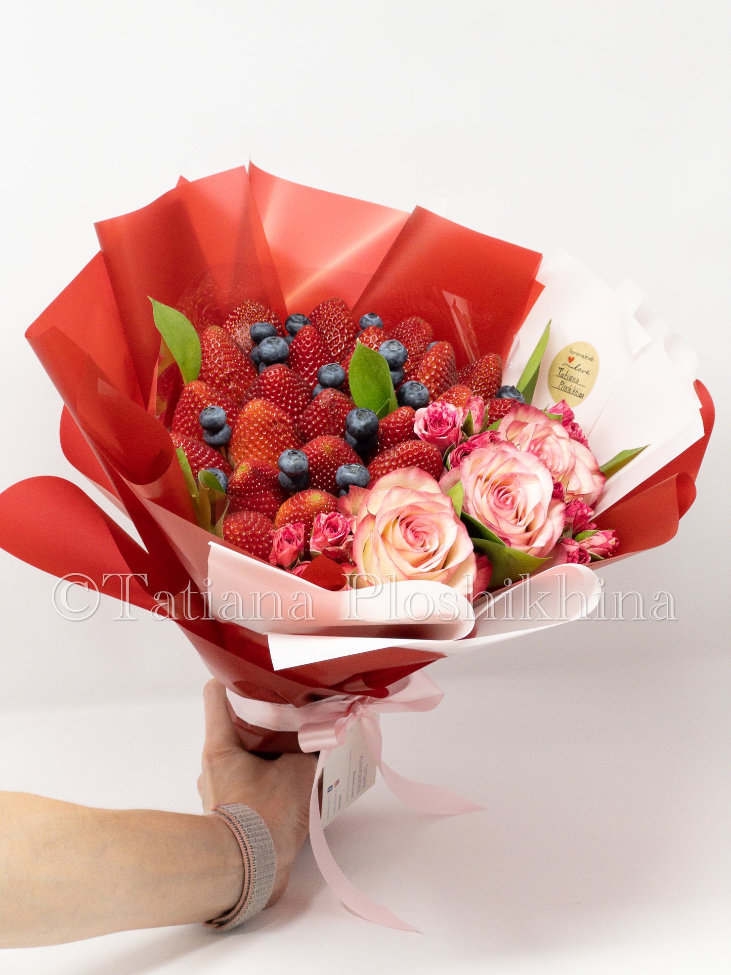 Berrys and fresh roses bouquet