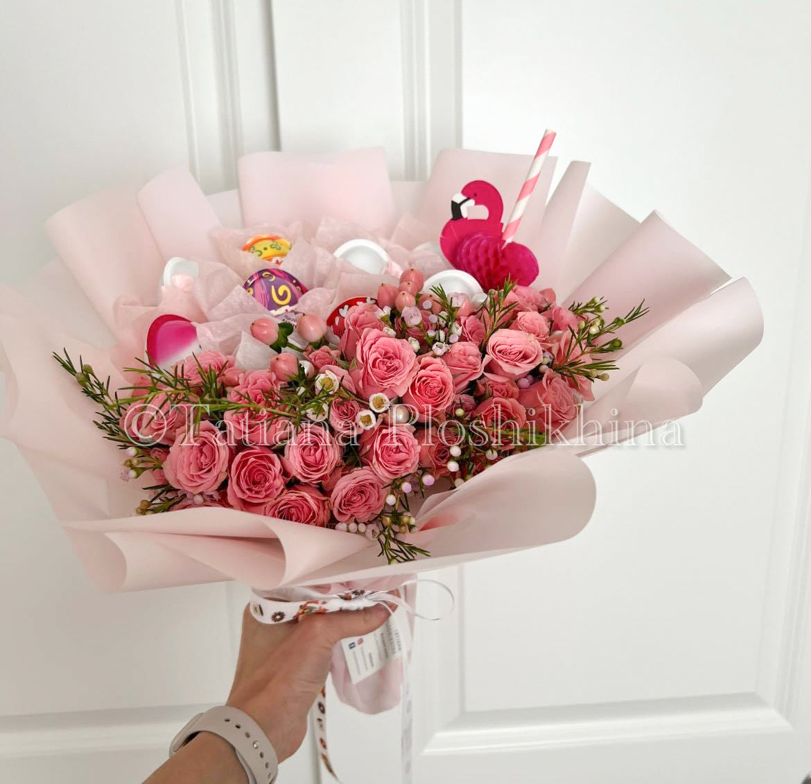 kinder chocolate and fresh spray roses bouquet.