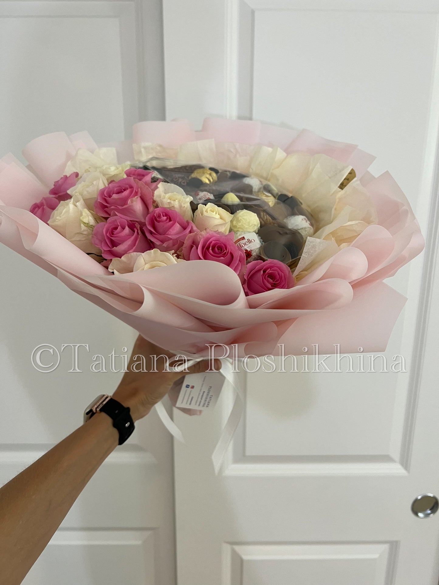 Candies and fresh roses bouquet