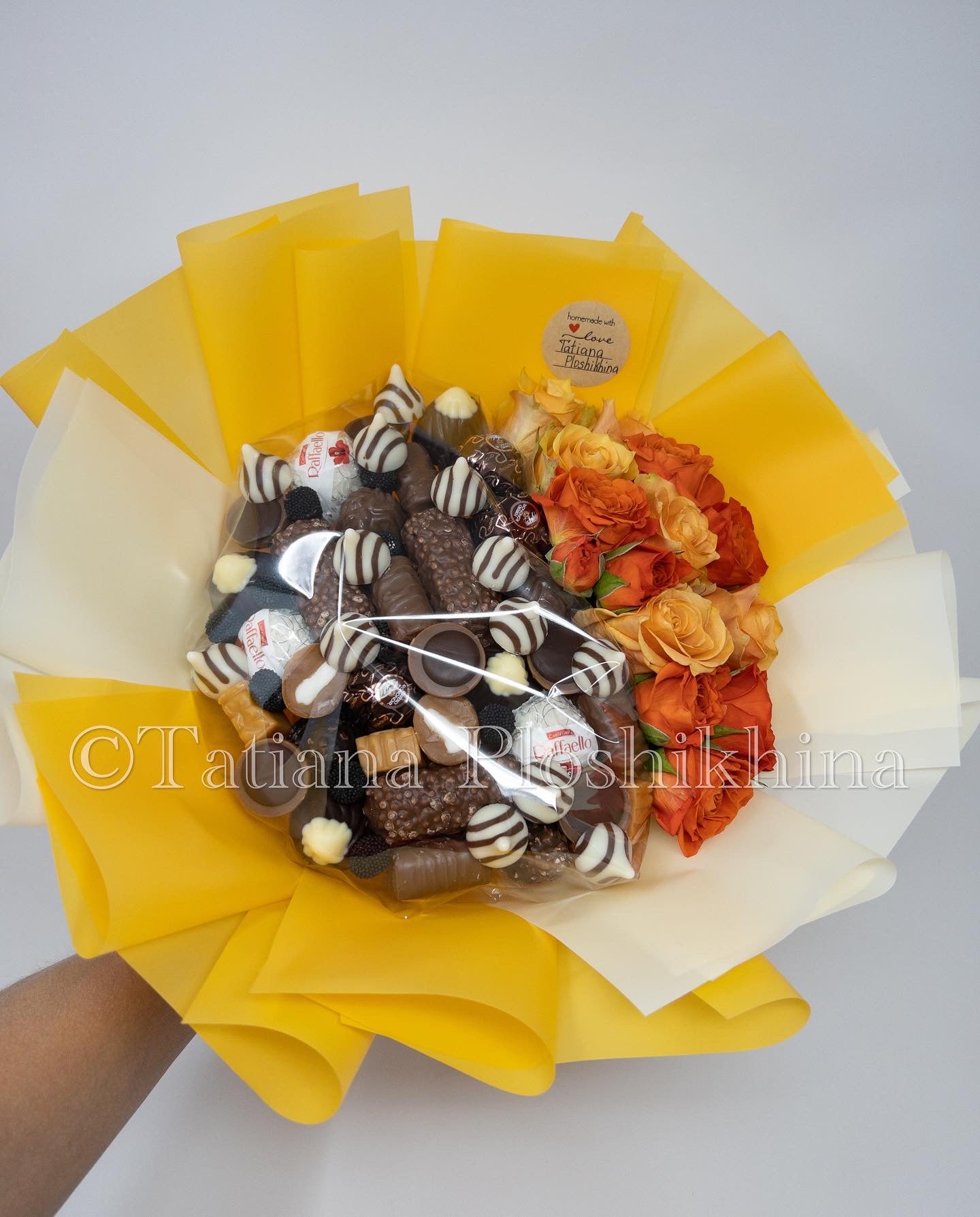 Candies and fresh roses bouquet